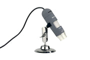 Celestron Deluxe Handheld Digital Microscope angled on its chrome desktop stand with cable attached