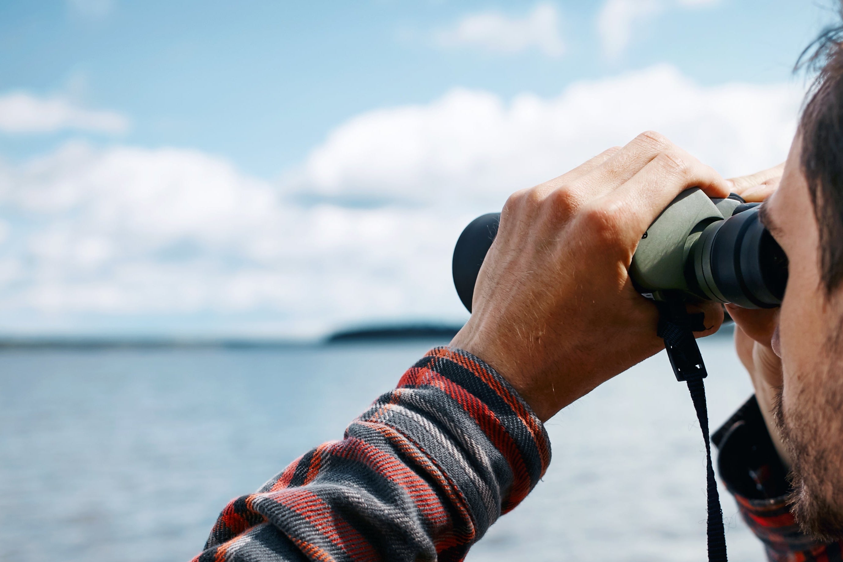 Man using binocular main slide show