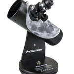 Celestron Robert Reeves Edition FirstScope Tabletop Telescope, with a black mount and tube, featuring a moonscape design near the base.